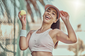 Image showing Happy, woman and tennis ball with smile for sports, exercise or fun workout in the summer outdoors. Portrait of female in sport fitness smiling for healthy cardio, tennis or training at the court