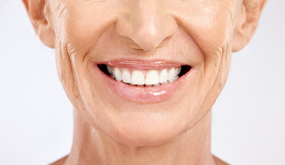 Image showing Teeth, mouth and smile of a senior woman with dental cleaning against a grey studio background. Dentist, wellness and elderly model with healthcare and happy with results from veneers for beauty