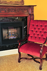 Image showing Fireplace and red chair