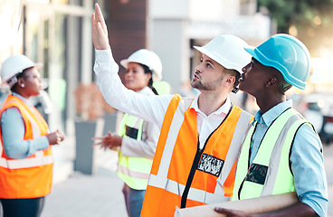 Image showing Construction worker, team and collaboration with building engineer leader or safety manager. Teamwork, industrial engineering colleagues and contractor men discuss architecture maintenance in city