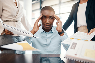 Image showing Headache, overwhelmed businessman and work report stress in office with team. Black man, stressed business management leader and corporate mental health burnout or frustrated employee depression