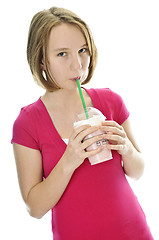 Image showing Teenage girl with milkshake