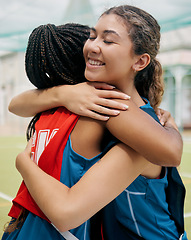 Image showing Sport, hug and student girl game match showing support, trust and teamwork on a outdoor field. Student soccer or netball player with a happy smile show diversity and congratulations together