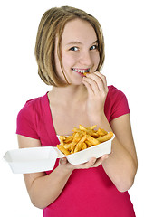 Image showing Teenage girl with french fries