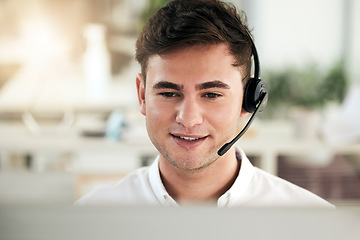 Image showing Man, call center and consultant with smile for communication, telemarketing or advice at the office. Happy male employee agent smiling with headset in contact us, consulting or desktop support