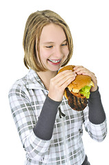 Image showing Teenage girl holding big hamburger