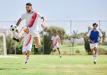 Image showing Football, soccer players in match and competition game with professional adult footballers with temwork, passion and athletic skill. Outdoor grass, soccer field with team running to kick soccer ball