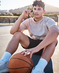 Image showing Basketball player, phone call and relax outdoor on floor talking, networking or communication for training, fitness and sports strategy advice. Basketball teenager on ground with 5g smartphone chat