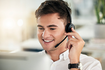 Image showing Headset, young man and call center for customer service, communication and sales growth. Telemarketing, male employee and consultant happy to have conversation, being helpful and talking with clients