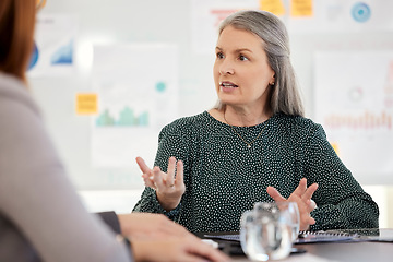 Image showing Manager, coaching and training team, communication and presentation in marketing and advertising company table. Mature woman, mentor and planning a strategy, managementor working in startup business