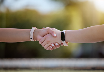 Image showing Handshake closeup, teamwork and sports watch fitness collaboration, partnership or agreement after game. Athletes greeting, well done exercise wellness and goal motivation or healthy competition win
