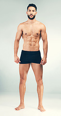 Image showing Portrait, bodybuilder and healthy man for fitness, wellness or workout being toned for flex with studio background. Muscular male, health or athlete muscle with endurance, power or body care exercise