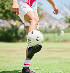 Image showing Soccer ball control, soccer player and practice skill on football field, competition games or sports training on stadium grass pitch. Football player feet, athlete action and talent for goals on turf