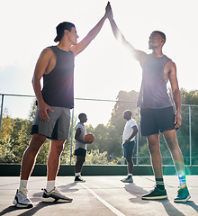 Image showing Basketball, high five and teamwork with a sports man friends in celebration as a winner on a court. Fitness, goal or success with a male basketball player and friend celebrating a winning achievement