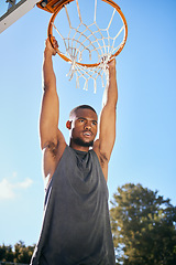 Image showing Basketball, sports and black man hanging on hoop at a game during summer. Energy, action and African athlete thinking at a basketball court with motivation and commitment to outdoor urban sport