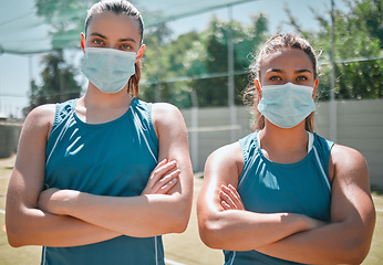 Image showing Badminton, face mask and women with arms crossed for sports, training and commitment as a team on court. Teamwork, collaboration and portrait of friends with safety from covid during sport exercise