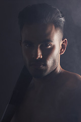 Image showing Fitness, baseball bat and portrait of man in studio background in dark creative art shoot in India. Beauty, danger and professional male model, topless Indian man and serious face on black background