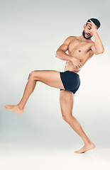 Image showing Health, fitness and body of a man in studio for health, wellness and self care motivation for a healthy lifestyle. Strong aesthetic model in underwear for exercise, training and workout goals