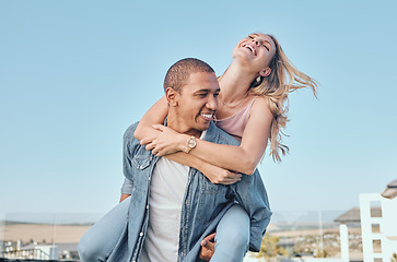 Image showing Interracial, couple and piggy back with outdoor fun of a happy girlfriend and boyfriend feeling love. Happiness of a woman and man together for anniversary or engagement announcement with a smile