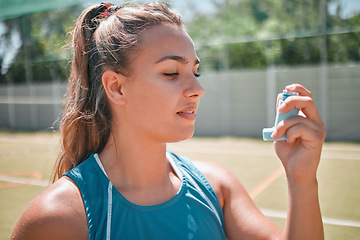 Image showing Woman, fitness or medical asthma pump on tennis court in workout game, training or exercise competition challenge. Sports athlete, asthmatic person or healthcare medicine inhaler for tennis player