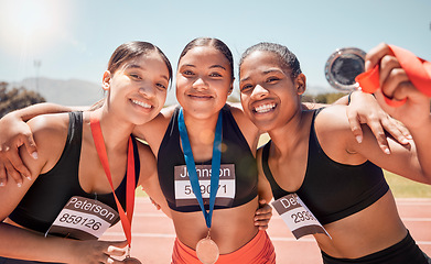 Image showing Fitness, woman and friends with smile for medal, winning or victory in running sport at the stadium together. Group of athletic women smiling in celebration for trophy winner, marathon or achievement