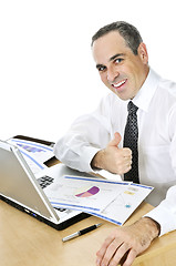 Image showing Businessman at his desk on white background