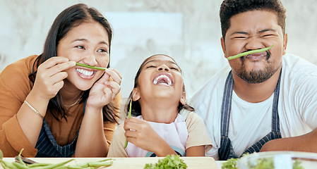 Image showing Happy asian family, play vegetables kitchen in portrait and smile together at table for bonding time. Mom dad, child happiness in comic home and health food in nutrition diet, dinner and kid cooking