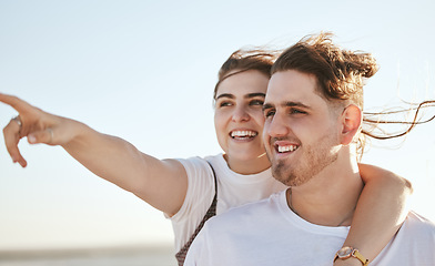 Image showing Vacation, view and travel with a normal couple sightseeing while on holiday together during summer. Sky, love and traveling with a real man and woman pointing while outside on a weekend getaway