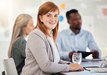 Image showing Business woman, smile and young lawyer in a team strategy meeting in a office board room. Portrait of a corporate law firm worker at a table ready for working on a business meeting collaboration