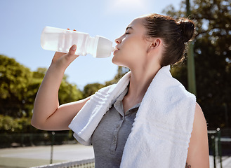 Image showing Fitness, woman with water bottle and hydrate after exercise workout, towel and drinking outdoor. Sport, healthy and active with break from training, hydration and health motivation with wellness.