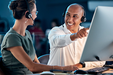 Image showing Call center, customer service and contact us, training and team leader help coworker, crm and communication at computer with headphone. Telemarketing, man and woman working together, support and call