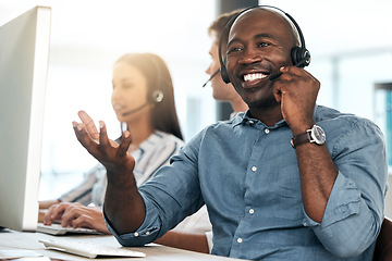 Image showing Call center, black man and talking for customer service, smile and headset in office. Telemarketing, happy male consultant or client support for sales growth, consulting and conversation for business