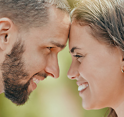Image showing Happy, couple and smile with forehead for love, romantic or relationship happiness together in the outdoors. Closeup of man and woman face smiling touching foreheads in romance, embracing or care