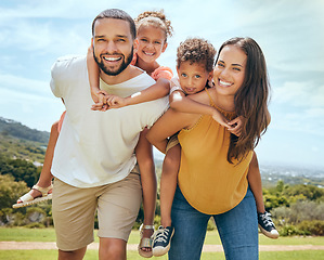 Image showing Happy family, mother and father with children on back in a nature park for bonding and relaxing in summer. Smile, mom an dad love enjoying quality time with siblings or kids outdoors for fresh air