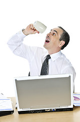 Image showing Overworked businessman at his desk on white background