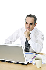 Image showing Businessman at his desk on white background