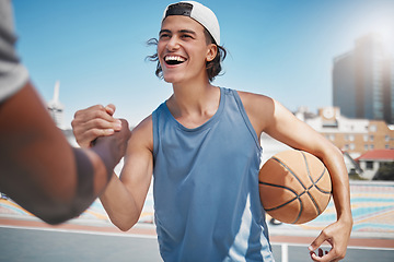 Image showing Sports, friends and handshake by man for basketball training at basketball court against a city, urban and background. Fitness, team and hands in support of sport goal, game and practice workout