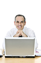Image showing Businessman at his desk on white background