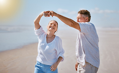 Image showing Happy senior couple, dancing and beach for summer vacation, romance or bonding together in the outdoors. Elderly man and woman with smile for romantic dance, anniversary or holiday joy by the ocean