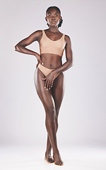 Image showing Black woman model, underwear studio for fashion, beauty or body care by white background. African, woman and lingerie bikini for healthy body, cosmetics or legs for confident skin wellness