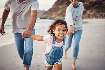 Image showing Family, beach and grandparents holding hands of girl on vacation, holiday or summer trip. Love, care and grandma, grandpa and happy kid enjoying quality time together, bonding and running on seashore
