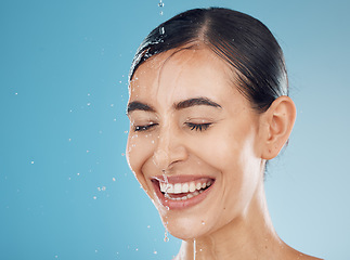 Image showing Beauty splash, woman face and water for hygiene skincare, grooming health and wellness for a morning routine. Shower of a young model with cosmetic, natural beauty and facial wash happy with a smile