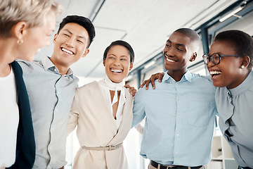 Image showing Happy, team building and business people hug in a meeting for successfully coworking in group collaboration. Diversity, teamwork and employees excited in a modern office with goals for growth