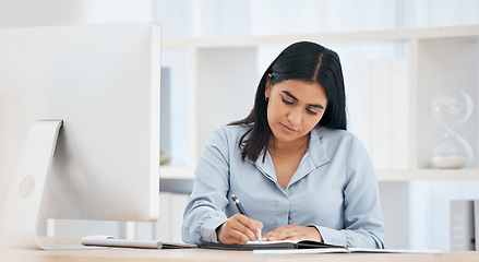 Image showing Business woman writing notes, schedule and planning ideas, meeting administration and research in notebook at office desk. Employee, receptionist and strategy reminder, calendar or agenda information