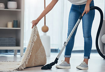 Image showing Woman, cleaning and doing house work with vacuum machine appliance for living room carpet to clean dirt or dust. Feet of female cleaner or housewife doing housekeeping on lounge floor for hygiene