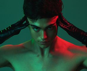 Image showing Art, psychology and gay drag queen man in studio with neon lighting for aesthetic, lgbtq and mental health background. Portrait of male posing alter ego, fashion and creativity for magazine cover