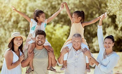 Image showing Family, love and outdoor, generations in park have fun out in nature, big family together and smile in portrait. Parents, grandparents and children bonding, arms up and happiness with care.