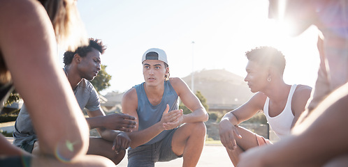 Image showing Basketball, team and meeting for sports game plan, strategy or collaboration on the court in the outdoors. Group of athletic people in sport discussion, teamwork or planning for competitive match