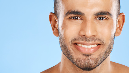 Image showing Skincare, portrait and man in studio for beauty, teeth and wellness against a blue background mockup. Face, cleaning and skin by model happy, smile and relax during grooming, hygiene and body care