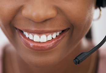 Image showing Call center consultant, black woman and smile in closeup of mouth with headset, customer service and support at help desk. Happy telemarketing agent, CRM work and advisory conversation or phone call.